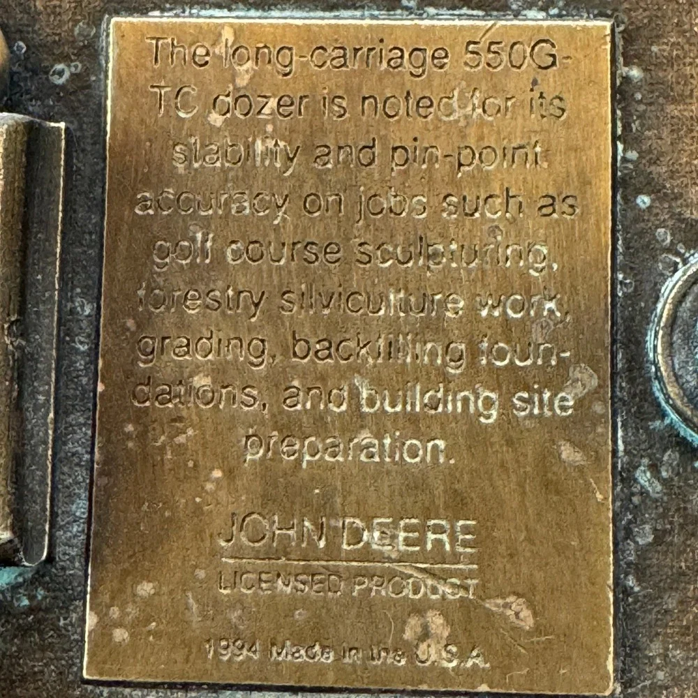 John Deere vintage brass